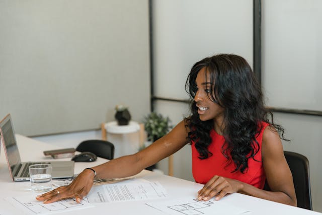 a%20property%20manager%20in%20a%20red%20shirt%20working%20at%20their%20desk a%20property%20manager%20in%20a%20red%20shirt%20working%20at%20their%20desk